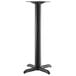 A black Lancaster Table & Seating Excalibur outdoor table base with a bar height column.