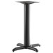 A black Lancaster Table & Seating Excalibur outdoor table base with a cross-shaped pedestal.