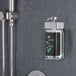A wall-mounted Dispenser Amenities SOLera shower soap dispenser with a rectangular bottle and Ginkgo label.