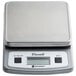 A grey San Jamar digital portion scale with a silver cover on the counter.