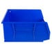 A blue rectangular Metro stack bin with a handle.