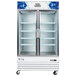 An Avantco white double glass door refrigerator with shelves.