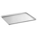 A Vollrath Wear-Ever heavy-duty aluminum bun and sheet pan on a counter.