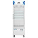 An Avantco white glass door freezer on wheels.