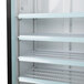 A black Avantco glass door refrigerator with shelves inside.