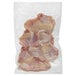A plastic bag of raw chicken meat.