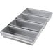 A silver Chicago Metallic bread loaf pan with 4 compartments.