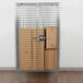 A Metro chrome wire security cabinet with a padlock on it.