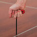 A person using a Palmer Snyder T-Handle Standard Hex Key to assemble a dance floor.