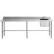 A Regency stainless steel work table with a sink and cross bracing.