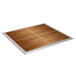 A wooden floor with silver trim on the corners.
