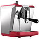 a silver and red espresso machine