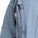 A Uncommon Chef Orleans long sleeve chef coat in steel blue with pen holders.