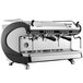 A silver and black Nuova Simonelli Aurelia Wave Digit 2 Group Espresso Machine with two coffee cups on it.