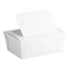A white paper take-out container with a tamper-evident windowed lid.