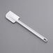 A white plastic Vollrath spatula on a gray background.