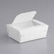 A white paper take-out container with a window.