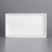 A white rectangular melamine platter with a gray border.