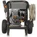 A Simpson gas powered pressure washer with a hose attached.
