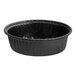 A black plastic bowl with a black plastic Solut baking cup inside.