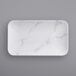 a white rectangular plate with marble pattern