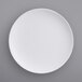 An American Metalcraft matte white melamine plate on a gray surface.