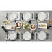 A table set with American Metalcraft Mix & Matte marble melamine plates and cutlery.