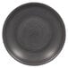 A black RAK Porcelain Trinidad deep coupe porcelain plate with a spiral pattern on it.