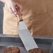 a person holding a wooden object