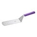 A Mercer Culinary Millennia Perforated Turner with a purple handle.