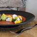 a plate of food on a wood surface