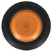A close up of a RAK Porcelain Trinidad cedar and black porcelain plate with a spiral design in black and orange.