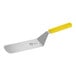 A metal spatula with a yellow handle.