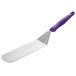 A Vollrath Jacob's Pride hamburger turner with a purple handle.