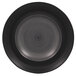 a circular black surface with a spiral pattern