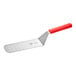 A Mercer Culinary Millennia perforated turner with a red handle.