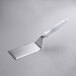 A Vollrath hamburger turner with a white nylon handle.