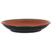A close up of a walnut and black RAK Porcelain Trinidad deep coupe plate.
