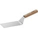 A Dexter-Russell metal turner with a wooden handle.