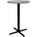 A Lancaster Table & Seating round bar height table with a black cross base.