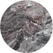 A round marble table with a circular pattern on the surface.