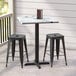 A Lancaster Table & Seating Excalibur square table with cross base and two stools.