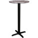 A Lancaster Table & Seating round bar table with a black pole.