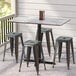 a group of stools on a tile floor