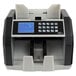 A black and grey Royal Sovereign bank note counting machine with a blue and white display.