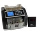 A black Royal Sovereign bill counter with cash on the counter and a digital display.