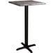 A Lancaster Table & Seating square bar height table with a black base and gray top.