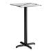 A square bar height table with a smooth Versilla finish top and a black cross base plate.