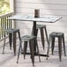 a group of stools on a tile floor