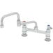 A T&S chrome deck-mounted faucet with double jointed swing nozzle and lever handles.
